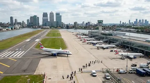 London City Airport runway with Canary Wharf in the distance