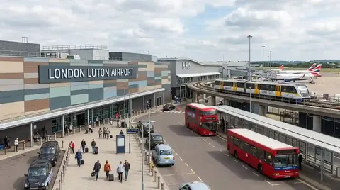 Buses and cars outside the London Luton Airport terminal
